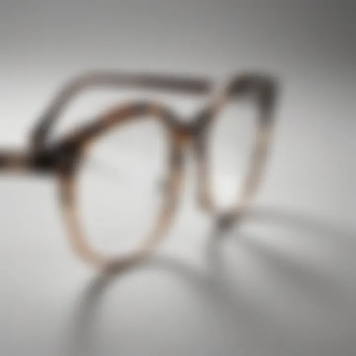 Close-up of clear glasses with tortoiseshell rims against a minimalist background